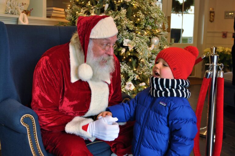 A boy talking with Santa